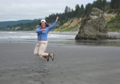 Mindy jumping on beach