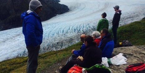 Tour Group hiking to glacier in Alaska.